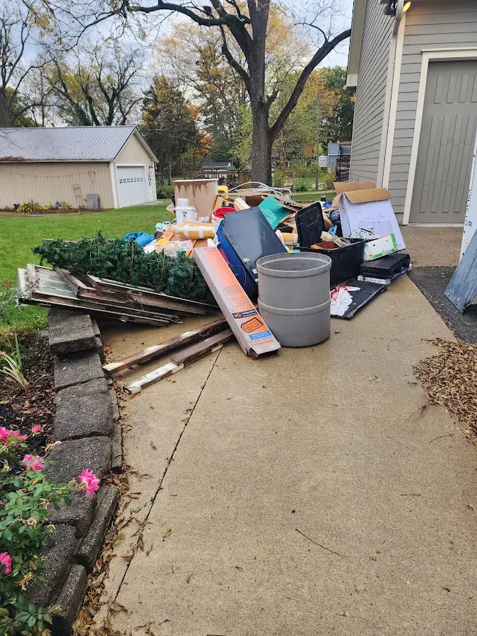 Dumpster being loaded with debris for 30 Yard Dumpster Rental in Marion